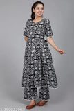 Black rayon palazzo set with three-quarter sleeves, printed net pattern. Pack of 2 sizes: M, L, XL, XXL. Ethnic Indian wear for contemporary casual style