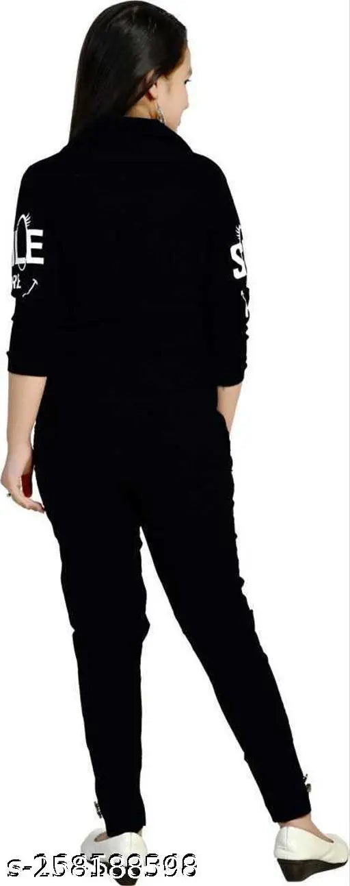 Black cotton dress set for girls aged 4-15 years, featuring printed three-quarter sleeves and ankle-length stretchable pants. Indian fashion for kids partywear or casual wear