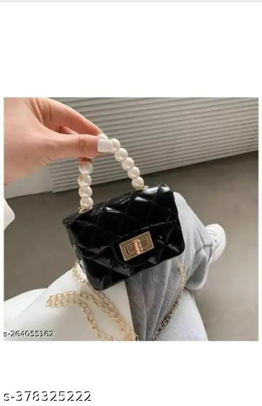 Silicon canvas & leather sling bag for girls in cutwork net pattern. Compact, chic, and ideal for minimalists with twist lock closure and golden chain strap." (124 characters)