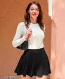 Classic stretchy skater skirt with attached inner shorts, imported high-quality fabric, solid color, high waistband, and laser cutout scallop hem. Stretchy for comfort, suitable for various seasons and sizes (26-36). Indian origin