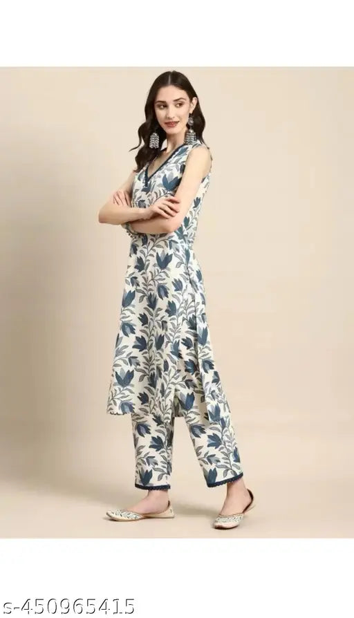 Cotton Woman printed kurta set with palazzos, three-quarter sleeves, vibrant Indian print. Perfect for family functions and long-wear