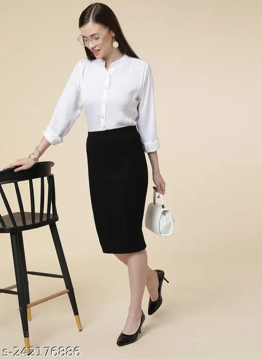 Black pencil skirt with back slit, polycotton solid black formal wear for women available in multiple sizes: 24, 26, 28, 30, 32, 34, 36, 38, 40, 42, 44. Made in India