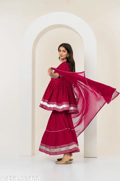 Starry red rayon Sharara set: flared kurta, sharara bottoms, and dupatta, ready-to-wear Indian ethnic ensemble with stitched net detail