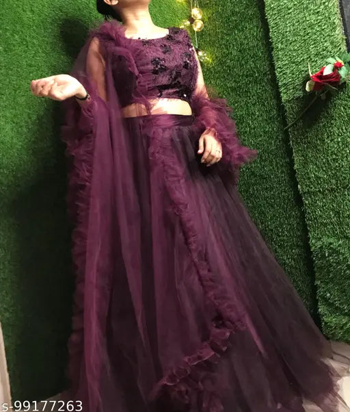 Wine-colored jute silk flared lehenga choli set with net dupatta, featuring ruffled details. Indian partywear for women and girls