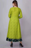 Green rayon anarkali kurti with three-quarter sleeves, printed combo, modest neckline, subtle embroidery, and ankle length. Made in India