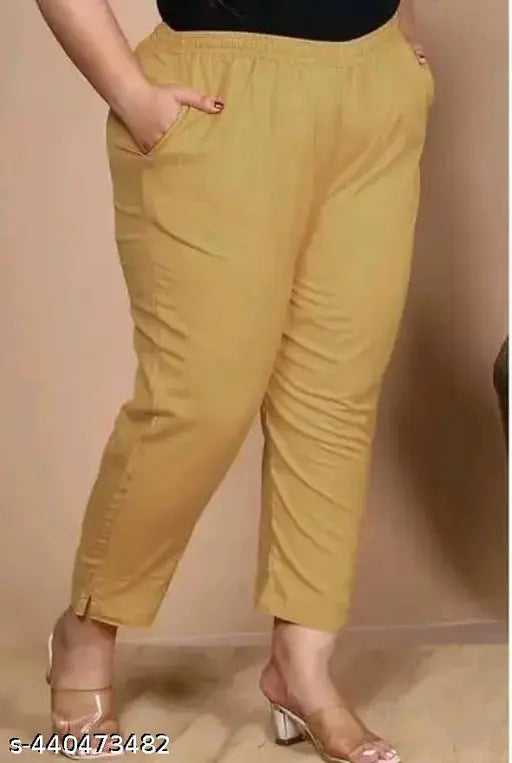 Golden cotton lycra pant, solid net design, available in various sizes from M to 4XL, perfect for pairing with tops, kurtis, or t-shirts. Made in India