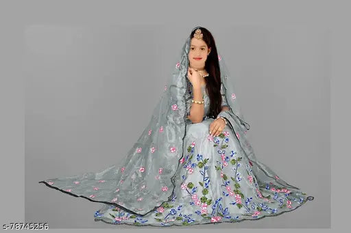 Embroidered cotton Lehenga Choli, semi-stitched with long sleeves, available in multiple sizes and net dupatta. Indian wedding kids' ethnic wear on display rack
