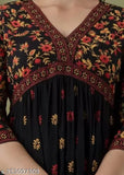 Elegant black Georgette floral print kurti with red and mud color accents, ideal for Diwali and Navratri wear. Pure rayon, handmade, three-quarter sleeves, A-line fit. Comfortable, affordable, and under budget for women. Handloom ethnicwear from India