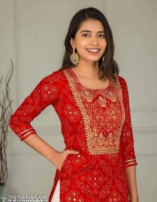 Mardi Kurta Set: Red embroidered salwar kameez with embellished blouse