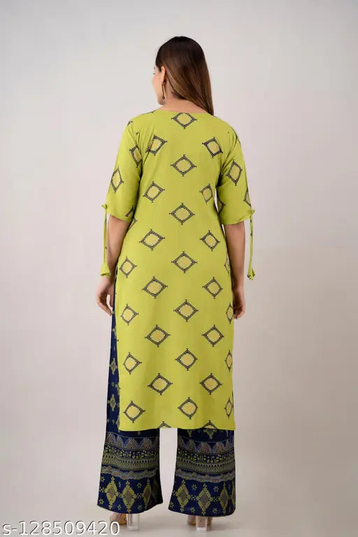 Green rayon floral kurti with printed plazo set, ideal for casual and party wear. Kurti features three-quarter sleeves and is part of the Zeenat Libaas latest collection. Perfect for card parties and events, team it with high heels and accessories. Indian made, offers a rich desi style