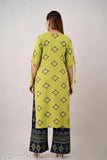 Green rayon floral kurti with printed plazo set, ideal for casual and party wear. Kurti features three-quarter sleeves and is part of the Zeenat Libaas latest collection. Perfect for card parties and events, team it with high heels and accessories. Indian made, offers a rich desi style