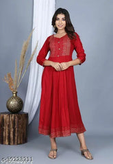 Stylish rayon kurti, embroidered designs, three-quarter sleeves. Modern ethnic wear for women's wardrobe