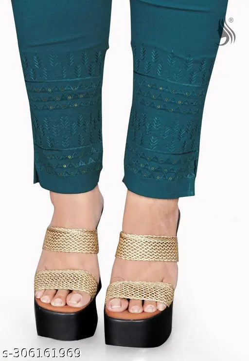 Deep teal cotton blend trousers for women, knitted and blended with lycra. Solid pattern, stylish fit. Wash separately, cold water, medium to hot iron. Available in sizes 28-38 (waist: 28"-38", length: 38"). Made in India