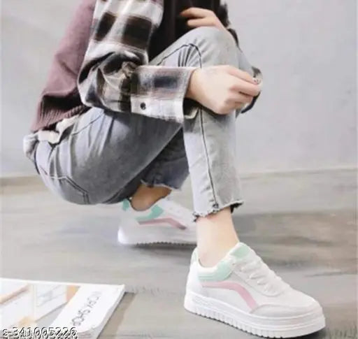 White mesh casual sneakers for kids, colorblocked design with lace-up fastening. Lightweight, breathable, and durable shoes with exclusive designs. Made in India