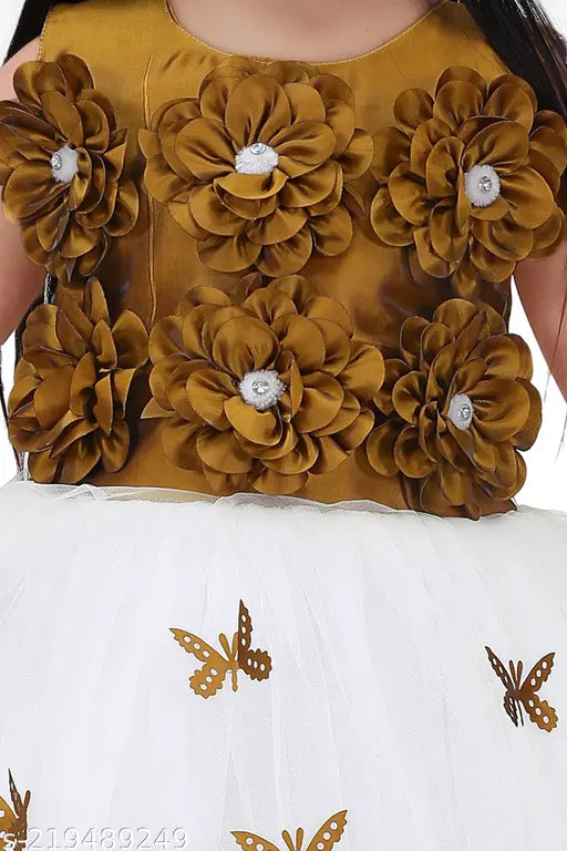 Elegant white and pat bodi color mix 3D flower designer frock with gold butterfly and floral embellishments for girls, net material, sleeveless, lace pattern. Party wear size: 4-5 years, 5-6 years, 6-7 years, 7-8 years, 8-9 years, 9-10 years. Handmade in India