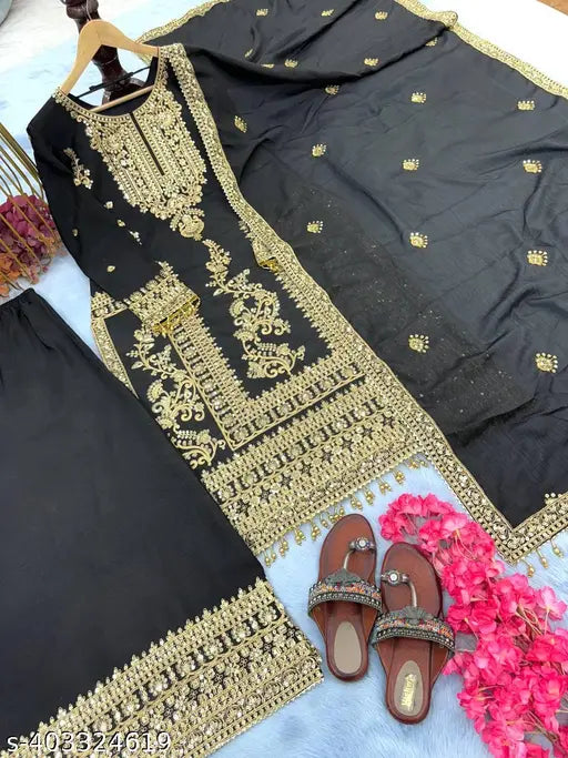 Black cotton silk embroidered kurta set with bottomwear and dupatta, adorned with 5mm sequin and dori work, long sleeves, and tassels. Made in India