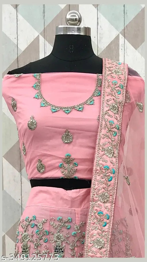 Designer pink net lehenga choli with dupatta and semistitched blouse, embellished with intricate embroidery. Free size, high-quality fabric, perfect for parties or special occasions. Indian ethnic wear