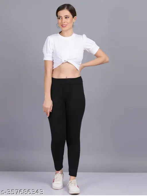 Black Lycra jeggings with pocket, women's active legging for yoga and gym wear. Solid black color, high waist, ankle length, stretchable, skinny fit. Sizes available from XS to XXL. Made in India