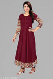 Maroon rayon Anarkali Kurti with three-quarter sleeves, solid border design. Casual yet elegant traditional dress suitable for various occasions. Perfect fit sizes available. Indian craftsmanship, comfortable cotton fabric