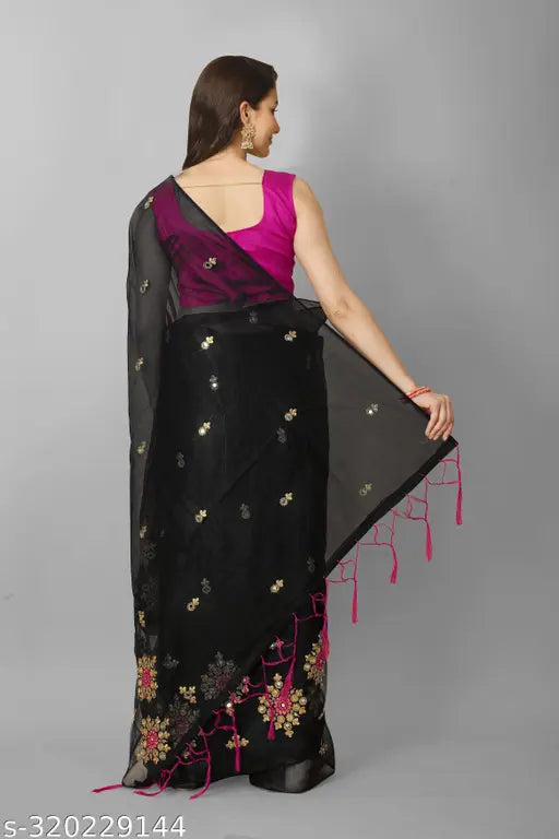 Heavy mirror work and super net fabric embroidery saree with separate dupion silk blouse, vibrant colors and intricate threadwork on display