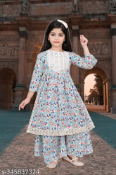 Modern girls cotton blend kurta & palazzo set in A-line shape with three-quarter sleeves, printed pattern. Size options available for ages 4-12 years. Indian origin