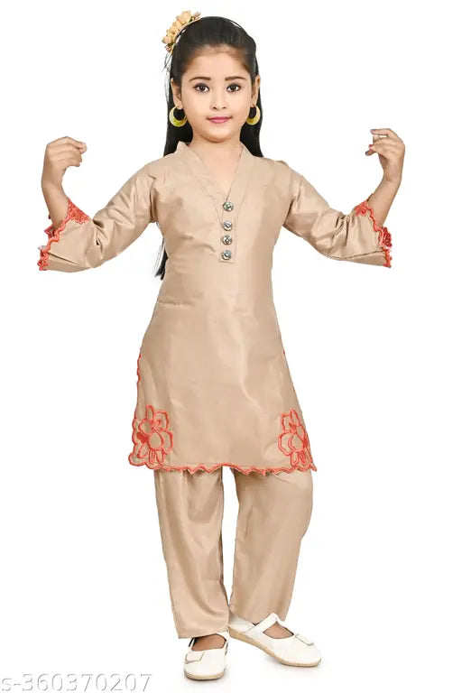 Brown polycotton kids kurti pant set with three-quarter sleeves and embroidered net pattern. Medium size for ages 6-7 years, displayed on a hanger