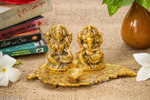 Gold oxide metal Ganesh idol statue on lotus flower with diya, Laxmi figurine showpiece (20x10x10cm)
