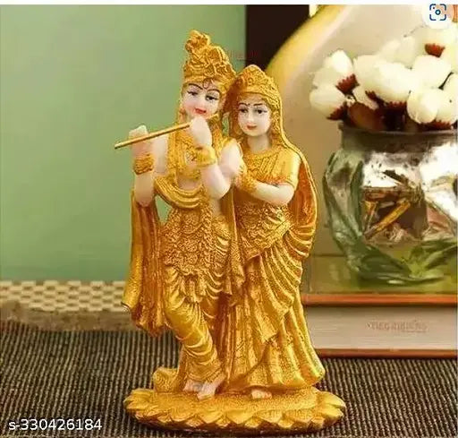 Gold-plated Radha Krishna showpiece statue, multicolor resin Krishna idol for home living room decoration or corporate gifts. Approximate dimensions: 11cm length x 19cm height x 11cm breadth. Made in India