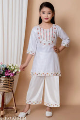 Embroidered rayon kurta palazzo set for girls, Indian festival fashion with three-quarter sleeves and knee-length design