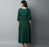 Green rayon cotton kurti with three-quarter sleeves and embroidery details. Women's fashion from India
