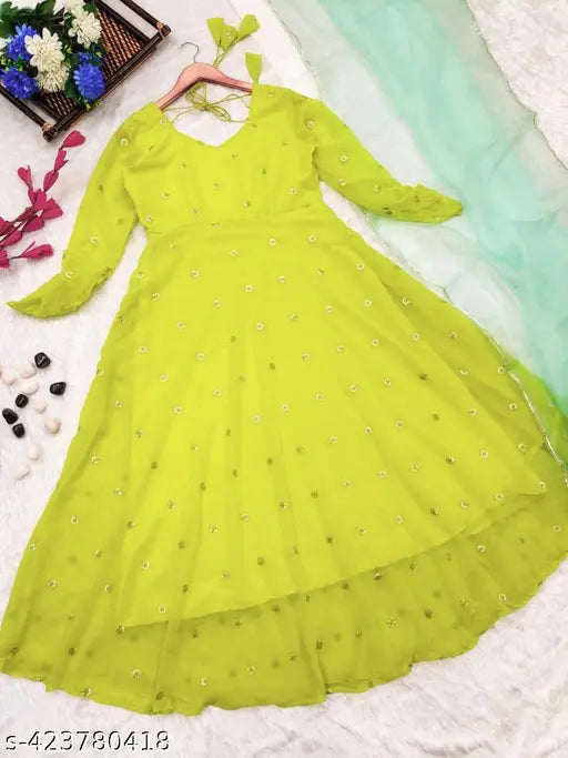 Green Georgette embroidered work gown with dupatta, traditional Indian attire in three-quarter sleeves on mannequin