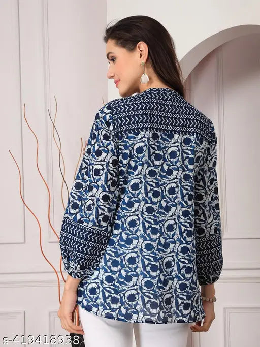 Navy blue viscose women's floral top with three-quarter sleeves, round neck, and printed pattern