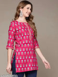 Premium rayon pink flower-printed short kurti for women, notch neck design, perfect with jeans. Soft, lightweight fabric for maximum comfort." (103 characters)
