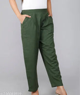 Green cotton trousers by Rakshita Fashions, ankle length with pleats, side pockets, and elasticated back. Ideal for casual, daily, office, travel wear