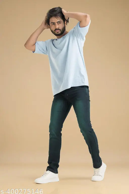 Green stretchable denim jeans for men. Solid design in a greenish black color. Affordable, expertly crafted jeans available in sizes 30, 32, and 34 (waist 31/33/35, length 40in each). Made in India