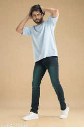 Green stretchable denim jeans for men. Solid design in a greenish black color. Affordable, expertly crafted jeans available in sizes 30, 32, and 34 (waist 31/33/35, length 40in each). Made in India