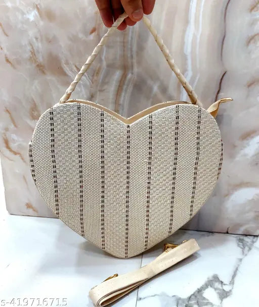 Handheld handbag with heart shape and shoulder strap, beige jute fabric