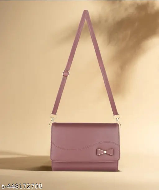 Pink PU vegan sling bag, 4 compartments, water-resistant, adjustable strap. Handcrafted Indian artistry, 100% PETA approved, ideal for travel essentials