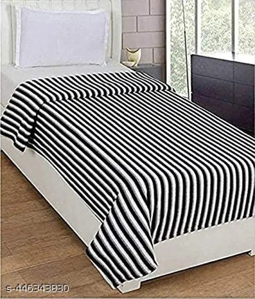 Black and white striped polyester AC fleece single bed blanket - lightweight, durable, and attractive fleece for regular use during winter seasons. Made with natural dyes. Free size (88in x 55in), origin India