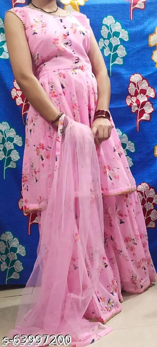 Beautiful pink Georgette frock Sharara Design with net dupatta and matching bottomwear, intricate lace work and mirror accents. Single piece in sizes M, L, XL, XXL, originating from India