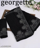 Black Georgette saree with trendy diamond work, embellished net blouse on mannequin