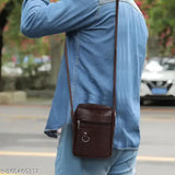 Faux leather/leatherette men's crossbody bag, solid net design, perfect for travel or office, adjustable shoulder strap, free size (L7in x W2in x H9in)