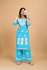 Rayon embroidered net kurta with palazzos, three-quarter sleeves, available in M, L, XL, XXL, XXXL, and 4XL sizes. Indian handcrafted fashion clothing on display