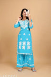 Rayon embroidered net kurta with palazzos, three-quarter sleeves, available in M, L, XL, XXL, XXXL, and 4XL sizes. Indian handcrafted fashion clothing on display