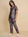 Dark grey quirky print satin night suit for women, featuring half sleeves, notch collar, and soft elastic waist. Indian-made sleepwear with stylish printed shirt and pyjama bottoms