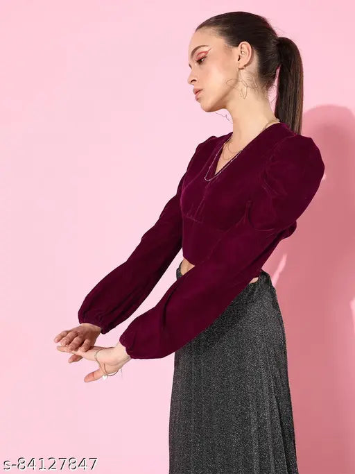 Maroon polyester puff sleeve crop top with smocked detail, solid color on mannequin