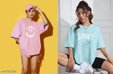 Oversize pink & sky blue spooky women's cotton blend t-shirt with printed face smiley pattern, three-quarter sleeves. Available in S to XXL sizes. Made in India