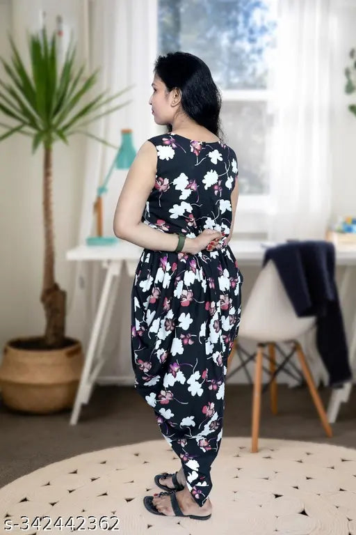 Black crepe dhoti jumpsuit with printed net pattern, sleeveless and available in S, M, L, XL sizes