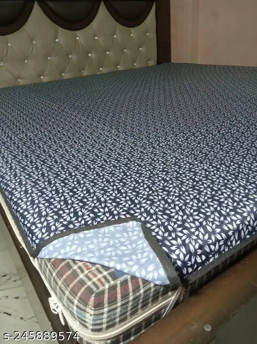Blue printed PVC waterproof baby mattress protector, soft terry cotton feel with TPU film for elastic tuck-in corners. Waterproof and breathable protection against allergens, easy wash in the machine
