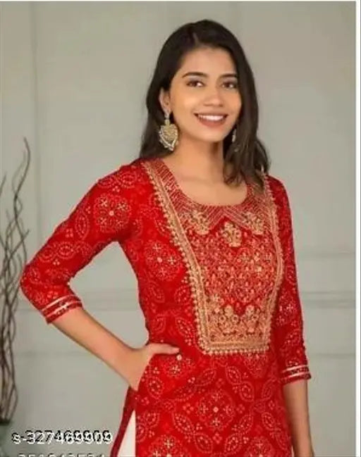 Red and gold printed festive women's kurta set with sharara